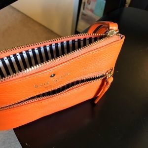 Kate Spade orange leather wristlet